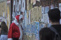 man dressed as Santa Claus walking in Santiago after the October 2019 civic uprising