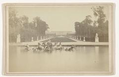 Apollo statue and fountain in the Basin of Apollo Saturn in the park of Versailles Chateau de Versailles