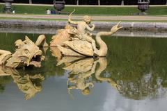 Dragon's pool in the park of the Palace of Versailles, France