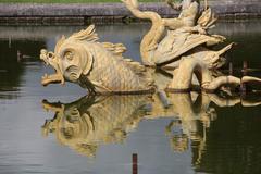 Dragon's pool in the park of the Palace of Versailles, France