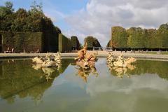 Dragon's pool in the park of the Palace of Versailles, France