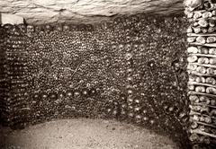 Wall covered with skulls and bones in the Paris Catacombs