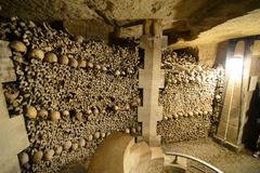 Catacombs of Paris ossuaries with human skulls and bones