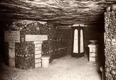 Paris Catacombs passage with walls covered in skulls