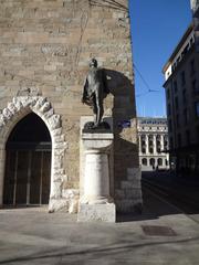 Tour de l'Île and statue of Philibert Berthelier in Geneva