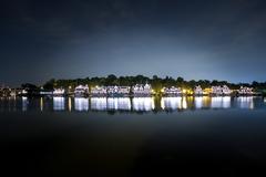 Boat House Row in Philadelphia at night with reflections in the water