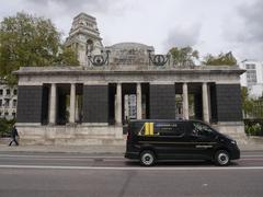 Addison Lee Couriers van passing Tower Hill Memorial pavilion in May 2018