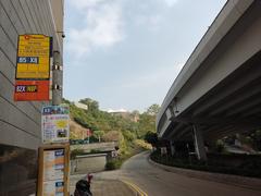 Bus stop signs near Hong Kong Museum of Coastal Defence on Tung Hei Road, December 2021