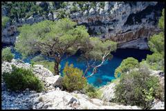 Calanque de Port-Miou with clear blue waters and rocky cliffs