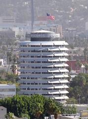 Aerial view of downtown Los Angeles with skyscrapers and mountains in the background