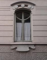 ornate arched window with floral design