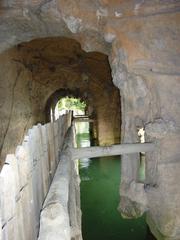 Cascade de Gairault with historical building in France