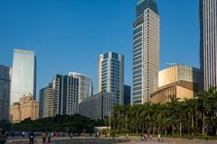 A wide shot of Huacheng Square in Guangzhou with modern skyscrapers in the background