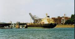 Collier CONARA leaving Blackwattle Bay in 1989 with cranes at CSR Sugar Refinery in background