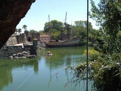 view of the central lake from a bridge with a vintage ship in the background