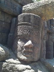 Amerindian stone head at Isla Mágica theme park