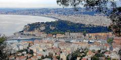 Panoramic view of Nice port with boats and Castle Hill in the background