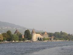 Château de Rolle with surrounding greenery and Lake Geneva