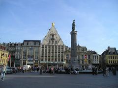 Lille Grand Place with historic buildings and blue sky