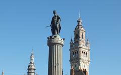 Column of the Goddess in the Grand Place of Lille with Chamber of Commerce tower and belfry in the background