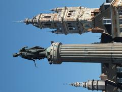 Column of the Goddess in Lille's central square with Chamber of Commerce tower and belfry in the background