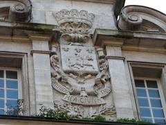 coat of arms on the façade of the Récollets convent in Cognac, Charente, France