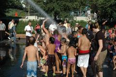 Children playing in Spit, water splashing