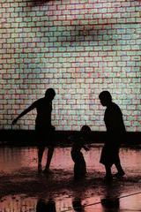 Crown Fountain silhouette in Chicago with people in the foreground