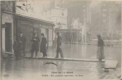 Improvised footbridge on flooded rue Gros in Paris, 1910