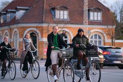 Bicycles parked in Frederiksberg, Copenhagen with a woman walking