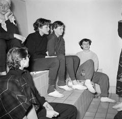 Eileen Ward Petersen and Dorrit Kristensen on the bleachers at the Frederiksberg swimming pool in March 1954