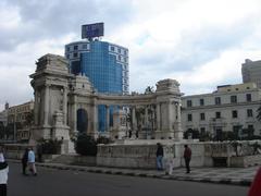 Orabi Square Alexandria with historic buildings and a bustling street scene