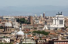 Roman rooftops and Altar of the Fatherland with surrounding hills