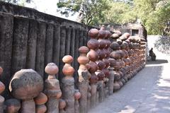 Wall made from earthen pots and vertical pipes in Chandigarh