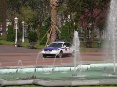 Two Ertzaintza police officers patrolling Casilda Iturrizar park from their patrol car