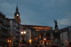 Plaza de la Virgen Blanca at dusk with Iglesia de San Miguel in Vitoria