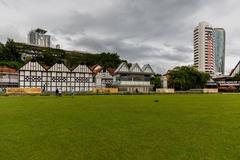 Merdeka Square in Kuala Lumpur with historical buildings and a large open field