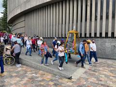 Pilgrims arriving at the Basilica of Guadalupe carrying a niche