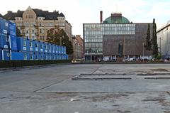 Rephotograph of a monument in Kaisaniemi, Finland with National Theatre in the background