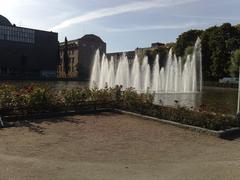 A scenic view of Kaisaniemi Park in Helsinki with lush greenery and clear skies