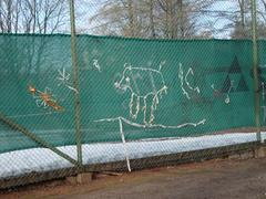 Knitted graffiti on a mesh fence in Kaisaniemi, Helsinki