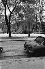 Snowy view of Bulevardi 14 towards the Old Church Park in Kamppi