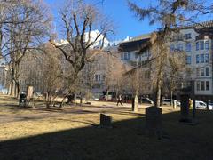 small graveyard in Helsinki with view of city buildings in the background