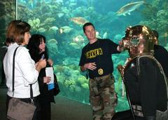 Chief Navy Diver Kevin Moore discusses MK-5 diving suit with visitors at Florida Aquarium