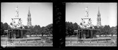 Pradier Fountain in Nimes with the bell tower of Sainte-Perpétue and Sainte-Félicité Church in the background