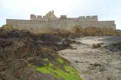 Fort National in Saint-Malo with a partly cloudy sky