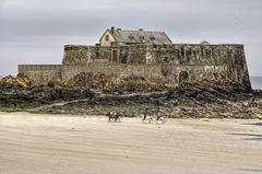 Fort National de Saint-Malo in Brittany, France with horse riders