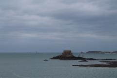 Fort National in Saint-Malo with its stone structure surrounded by water at high tide.