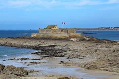 Fort National on tidal island with blue skies