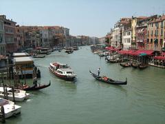 View from Rialto Bridge in Venice with gondolas and vaporetties on Canal Grande